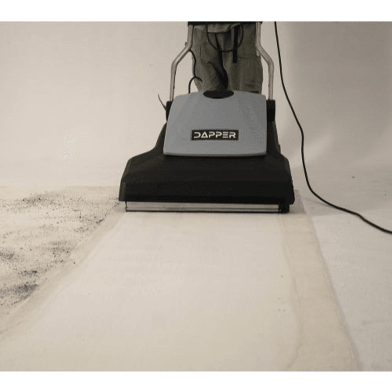 Dapper Supply 26-inch wide area vacuum cleaning a carpet showing the wide cleaning path.