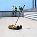 Tramex Roofing Master Kit - RMK A rooftop scene featuring the Tramex Roofing Master Kit in use, with individuals inspecting a roof, demonstrating the kit's application in roofing moisture detection.