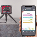 Tramex Water Damage Restoration Master Kit - WDMK Image showing the handheld device from the Tramex Water Damage Restoration Master Kit, designed for detecting moisture levels in various materials. The device features a digital display and is shown in a concrete environment, emphasizing its application for in-situ measurements.
