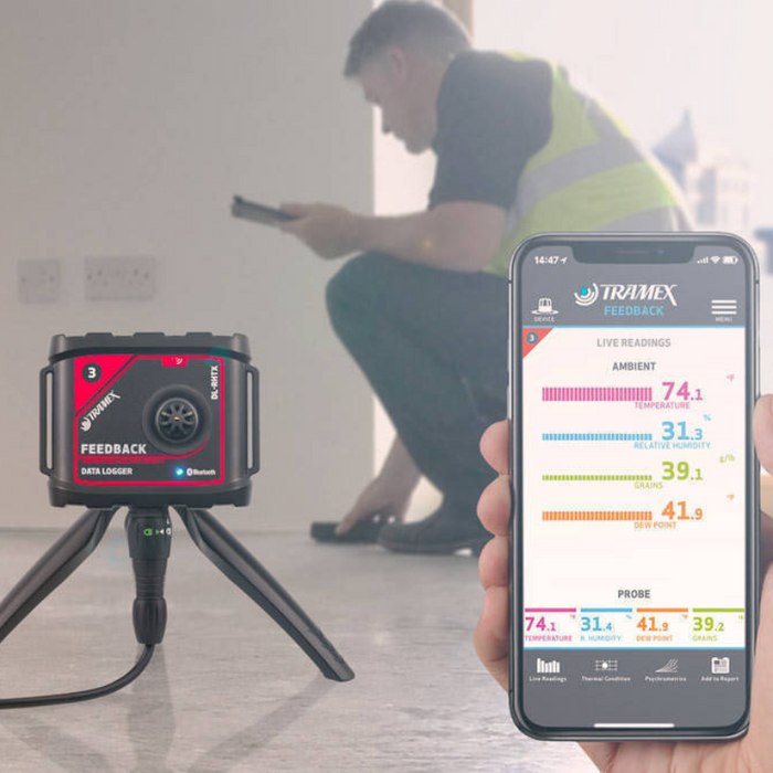 Tramex Flooring Installer Tech Kit - FTK A detailed image showcasing the Tramex Flooring Installer Tech Kit, featuring essential tools for moisture measurement and analysis in flooring installation, with a focus on a smartphone app displaying live readings.
