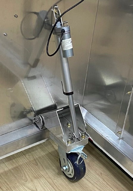 FloorZone corner electric actuator mounted above a locking caster