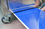 Clean Mat walk-off mat sliding out of the storage tray below a DUSTBUGGY end door