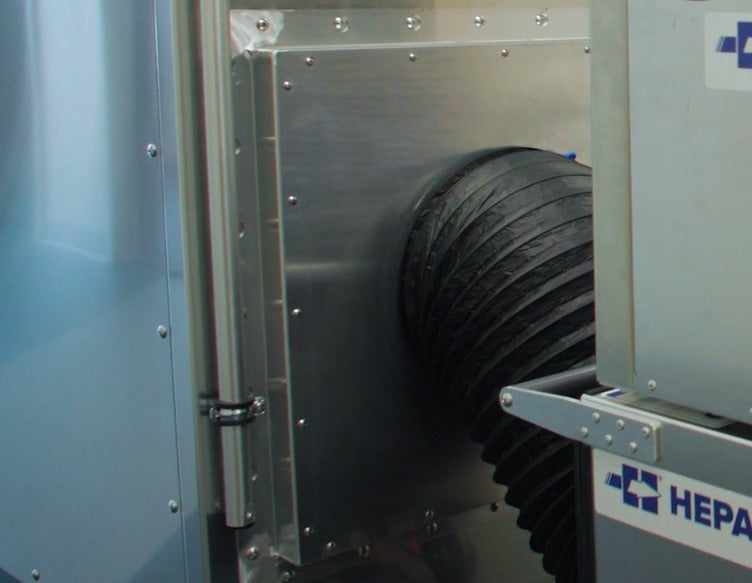 Export Adaptor panel on a DUSTBUGGY cart end with flex duct running to a HEPAFORCE unit