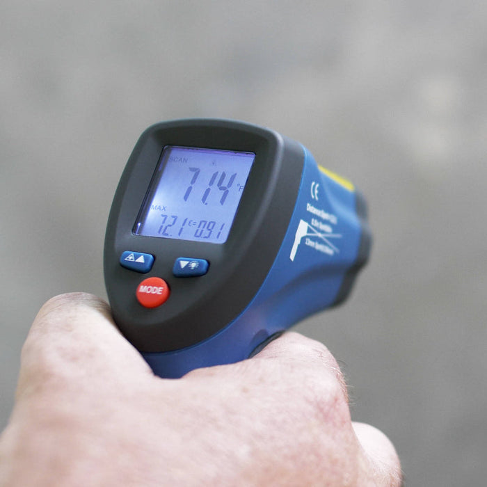 Tramex Flooring Inspector Kit - FIK Image of the Tramex Flooring Inspector Kit in use, showcasing the infrared thermometer with a handheld square on a wooden floor surface, demonstrating the kit's application in flooring inspections.