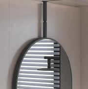 Laviva 313MFCPL-2440MB Hanging Pill 24" x 40" Matte Black mirror, hanging in a shower room, close-up