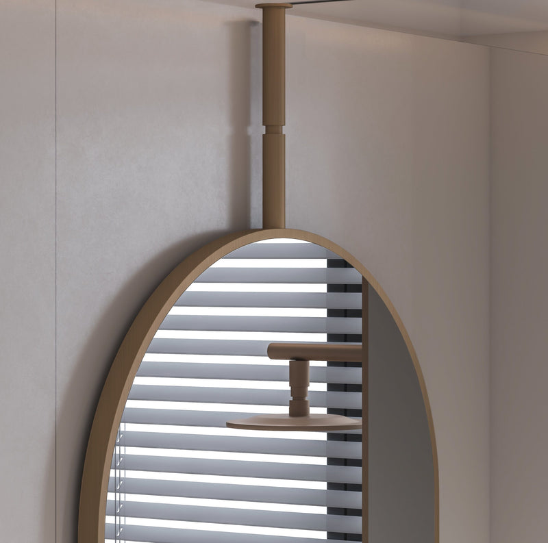 Laviva 313MFCPL-2440SB Hanging Pill 24" x 40" Satin Brass mirror, hanging in a shower room, close-up