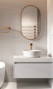 Laviva 313MFPIL-1832SB Pill 18" x 32" Satin Brass mirror, installed above a vanity