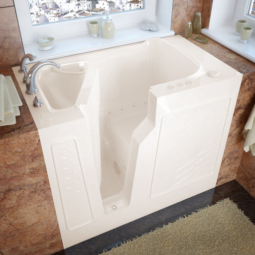 MediTub 2646LBA biscuit walk-in tub installed in a tiled bathroom, three-quarter view