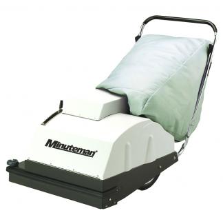 Minuteman 747 battery wide-area carpet vacuum with grey cloth filter bag and loop handle, front three-quarter view on white