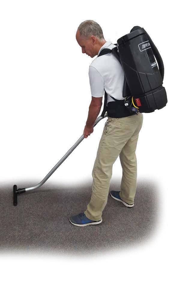 Minuteman BPV Pro worn on the back while vacuuming carpet, shown with an optional wand and floor tool (not included)