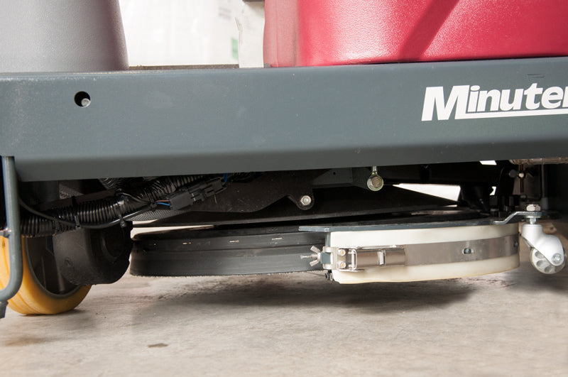 Close-up of Max Ride disc scrub deck and chassis on concrete floor