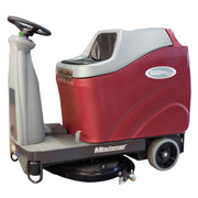 Minuteman Max Ride 26 rider floor scrubber, front left three-quarter view, shown with optional disc brushes (not included; ships with two 13" pad drivers)