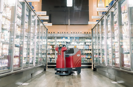 Minuteman RoboScrub 20 cleaning a grocery freezer aisle on its own