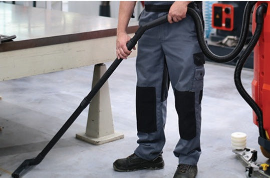 Minuteman Scrubmaster B120 R optional off-aisle vacuum wand (not included) cleaning under a workbench