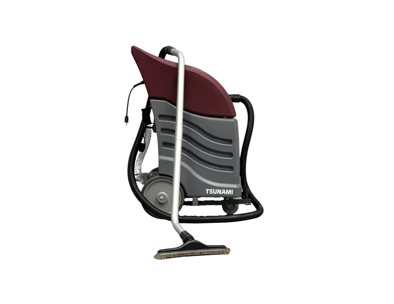 Minuteman Tsunami wet/dry vac (T16WD) set up for dry pickup, three-quarter view with hose, wand and floor brush on white