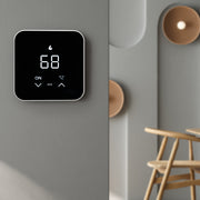 MST07 thermostat mounted on a gray wall beside a hallway