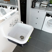 Nantucket Sinks CI-2218-FBSET utility sink wall-mounted in a laundry room with a chrome faucet and drain