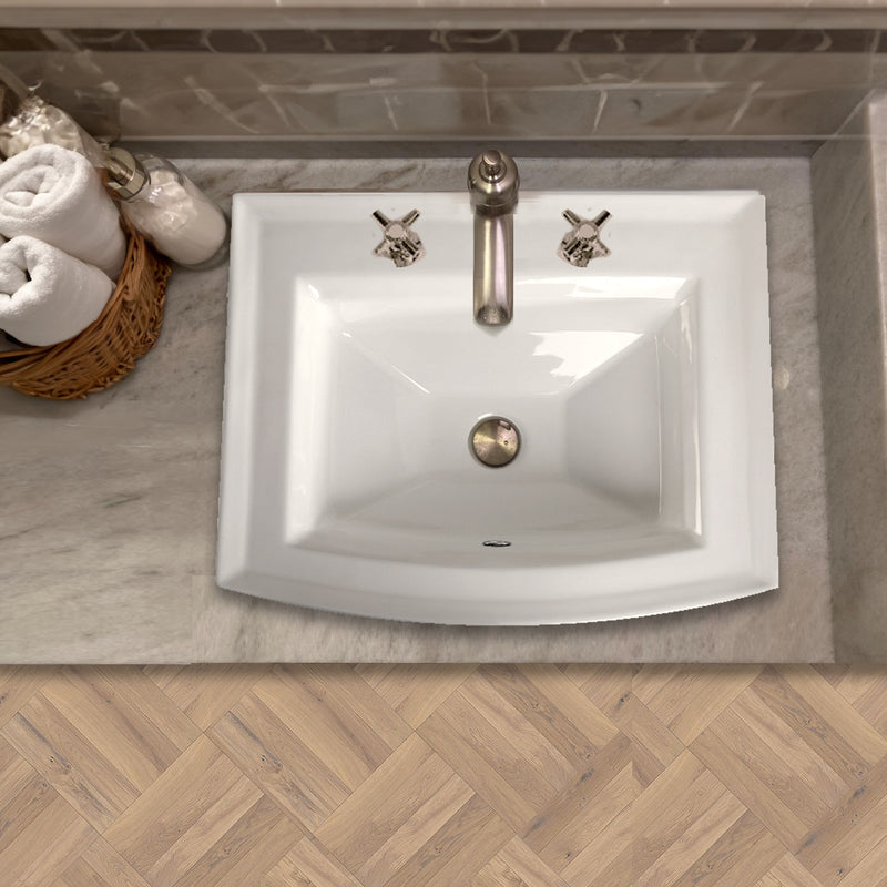 Nantucket Sinks DI-2320-R8 white drop-in sink in a stone vanity top seen from above with a widespread cross-handle faucet