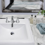 Nantucket Sinks DI-2418-R8 stepped-rim drop-in sink with a chrome widespread faucet on a marble counter