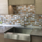 Nantucket Sinks EZApron33-5.5 installed under a stainless counter with a mosaic tile backsplash