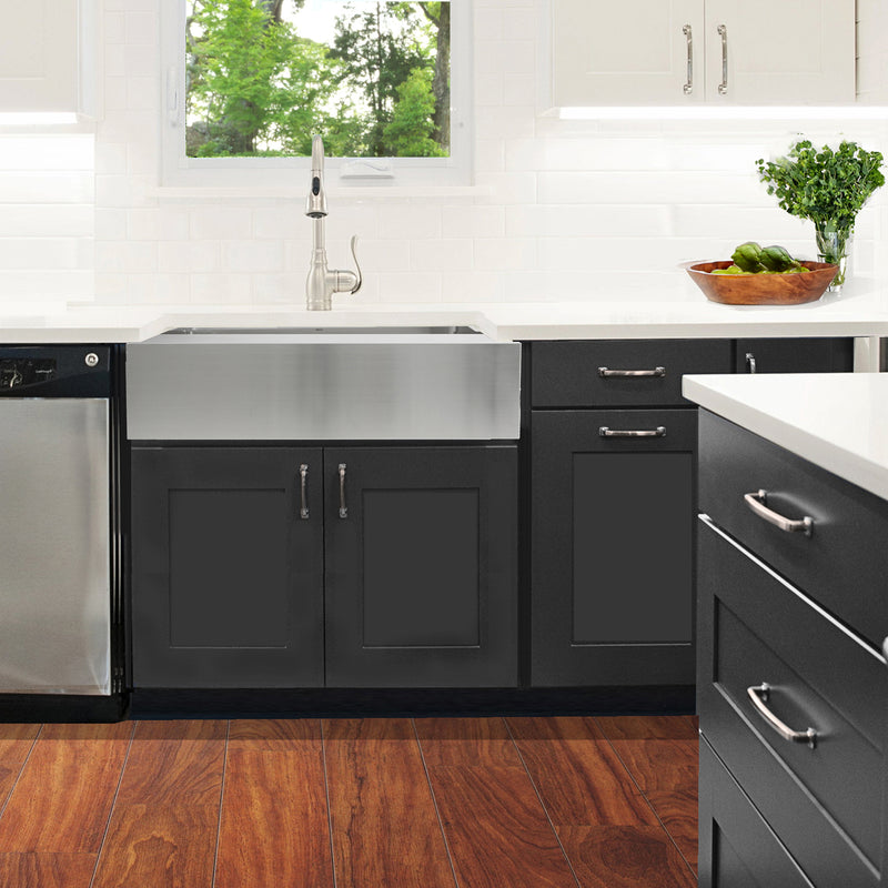 Nantucket Sinks EZApron33-9 installed over charcoal cabinets under a window, wood floor