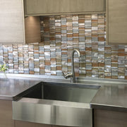 Nantucket Sinks EZApron33 installed under a stainless counter with a mosaic tile backsplash