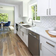 Nantucket Sinks EZApron33 installed in a white galley kitchen with herringbone tile