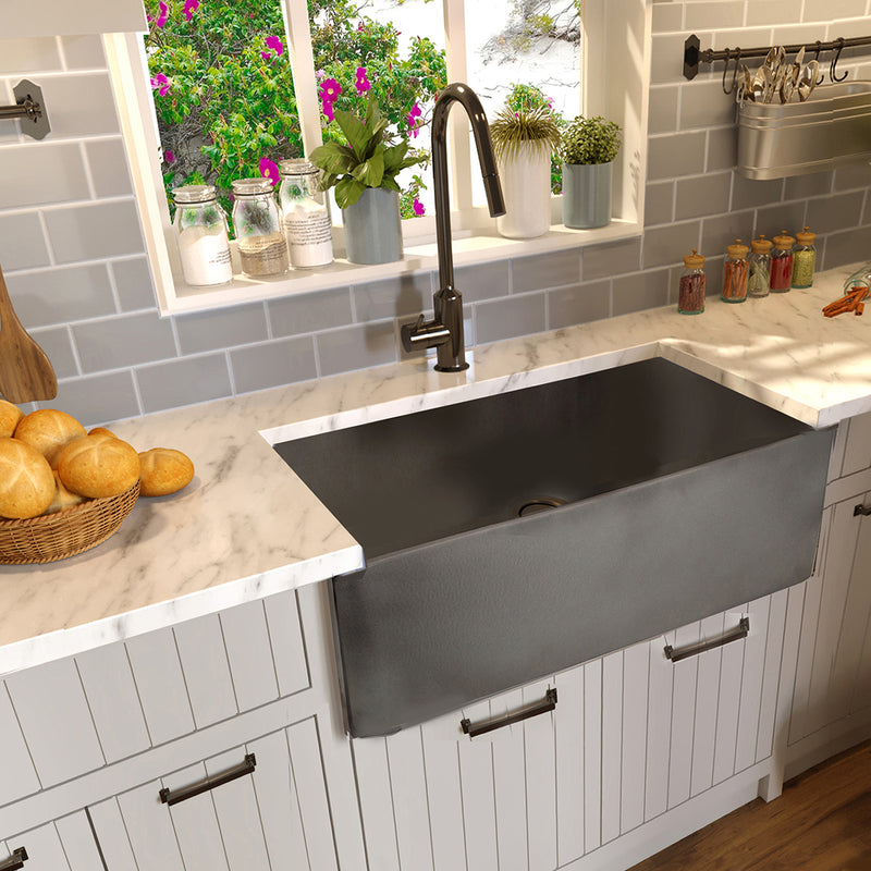 Nantucket Sinks FCFS3020S-Concrete Concrete farmhouse sink with marble counter, grey tile and beadboard cabinets
