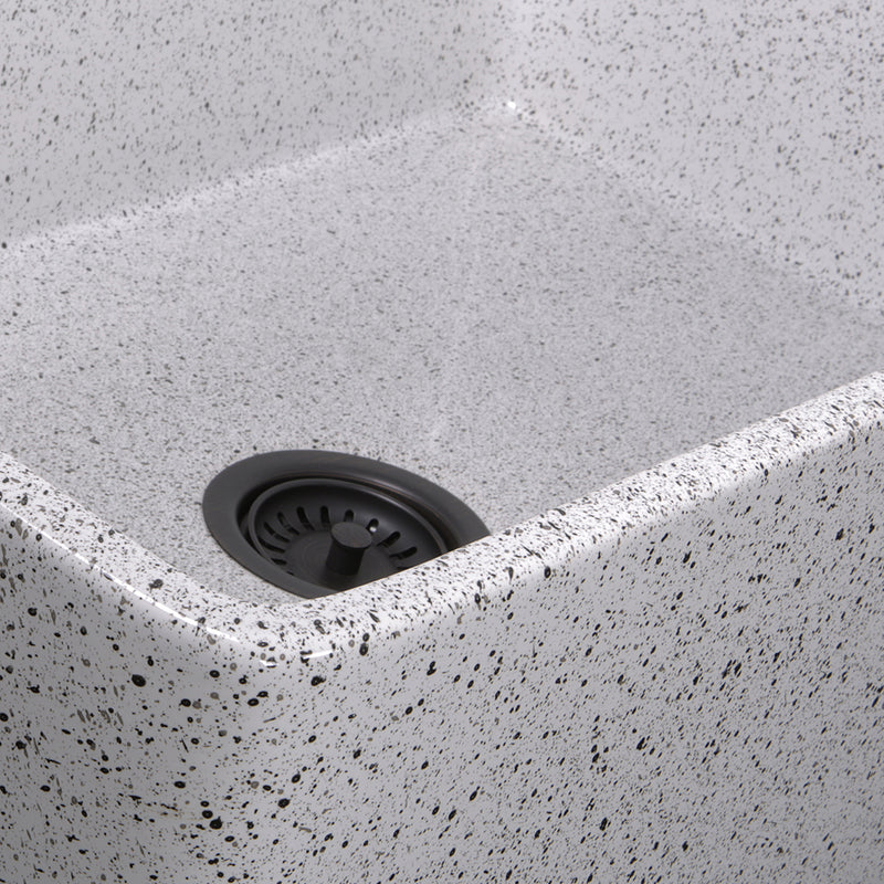 Nantucket Sinks FCFS3020S-PietraSarda close-up of the black and grey speckled Pietra Sarda glaze at the bowl corner