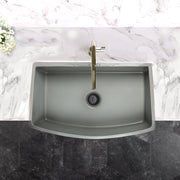 Nantucket Sinks FCFS3320CA-C Concrete curved apron sink from above set in a marble counter with brass faucet