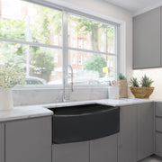 Nantucket Sinks FCFS3320CA-MB Matte Black curved apron farmhouse sink in grey cabinets under a big window