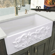 Nantucket Sinks FCFS3320S-Grapes Grapes farmhouse sink under a light quartz counter in grey cabinets