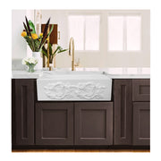 Nantucket Sinks FCFS3320S-Grapes Grapes farmhouse sink in dark wood cabinets with a brass faucet