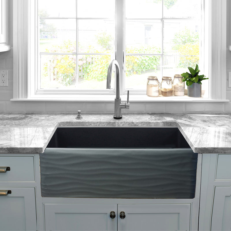 Nantucket Sinks FCFS3320S-MB-Waves Matte Black Waves farmhouse sink below a window with grey stone counters