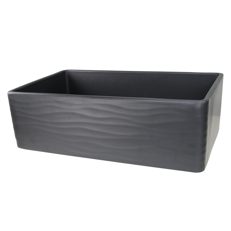 Nantucket Sinks FCFS3320S-MB-Waves Matte Black fireclay farmhouse sink, three-quarter view of the rippled Waves apron