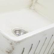 Nantucket Sinks FCFS3320S-ShabbyStraw close-up of the distressed Shabby Straw glaze and fluted apron edge