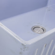 Nantucket Sinks FCFS3320S-ShabbySugar close-up of the Shabby Sugar blue glaze and fluted apron edge by the drain