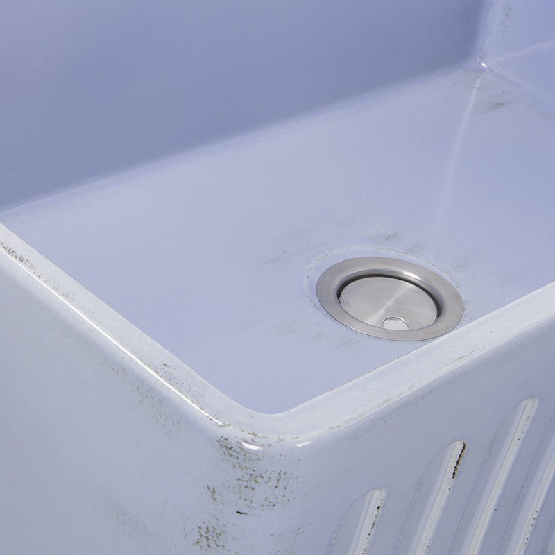 Nantucket Sinks FCFS3320S-ShabbySugar close-up of the Shabby Sugar blue glaze and fluted apron edge by the drain