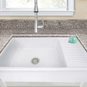 Nantucket Sinks FCFS36-DB drainboard farmhouse sink under a granite counter, close view of the drainboard