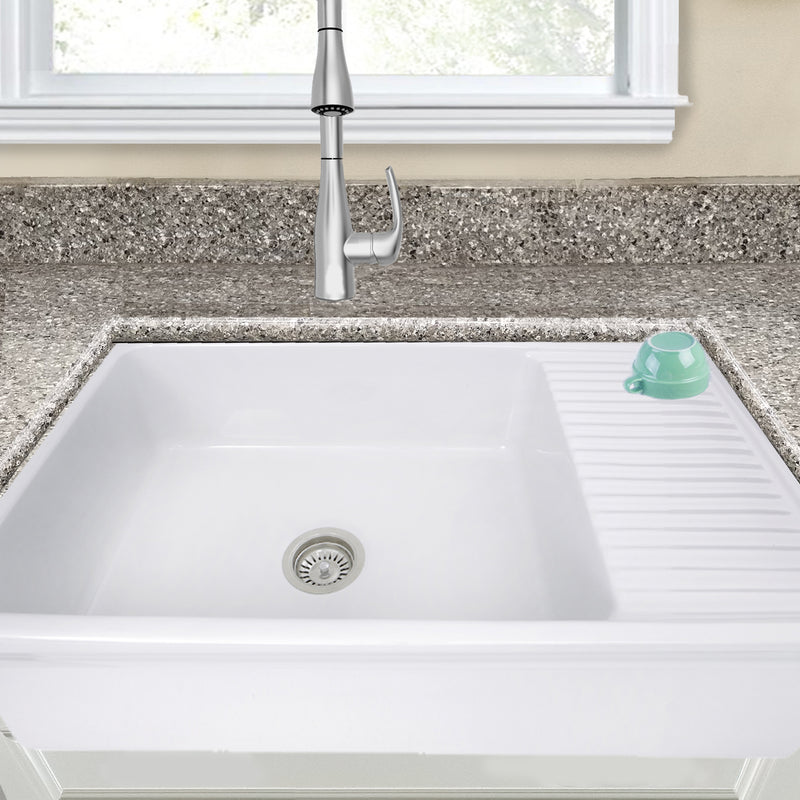 Nantucket Sinks FCFS36-DB drainboard farmhouse sink under a granite counter, close view of the drainboard