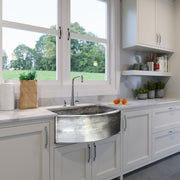 Nantucket Sinks FSSH3322 installed under a window in a white shaker kitchen