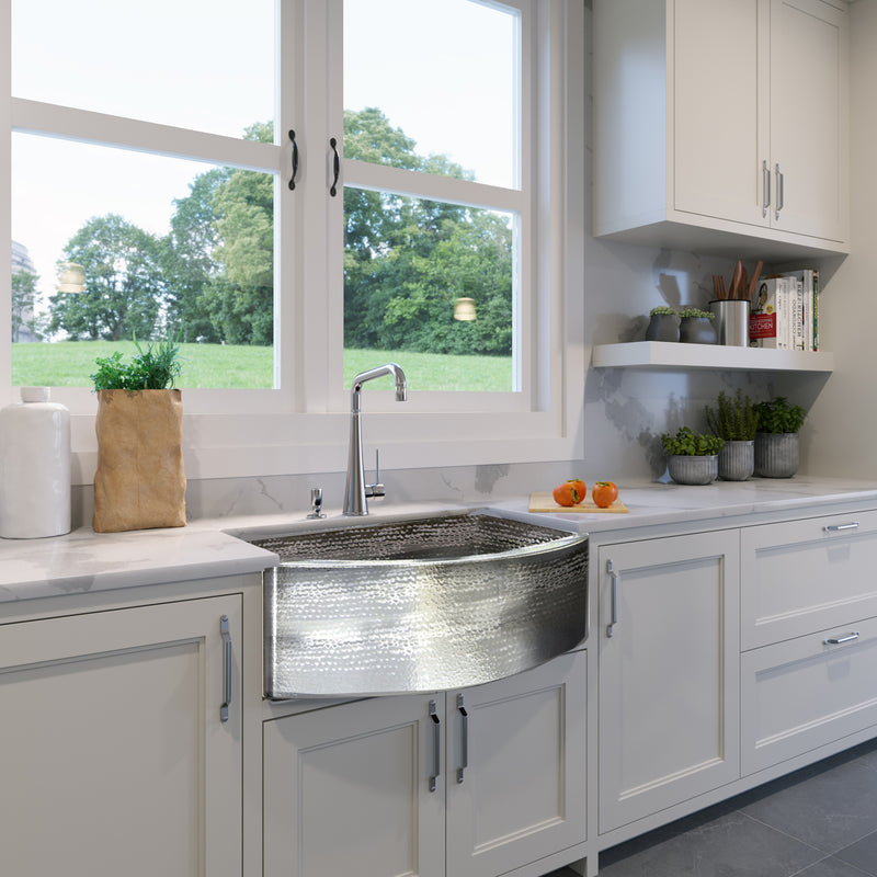 Nantucket Sinks FSSH3322 installed under a window in a white shaker kitchen