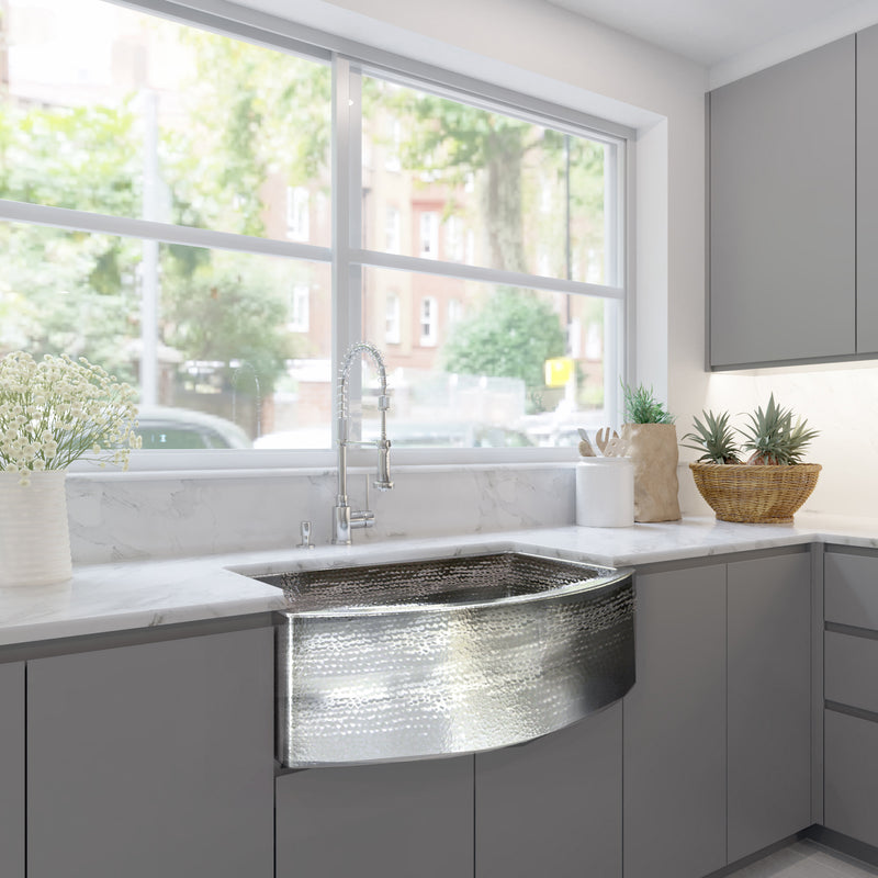 Nantucket Sinks FSSH3322 installed in a gray kitchen beneath a large window