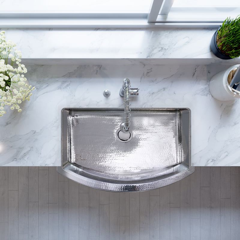 Nantucket Sinks FSSH3322 overhead view installed in white marble with a chrome faucet
