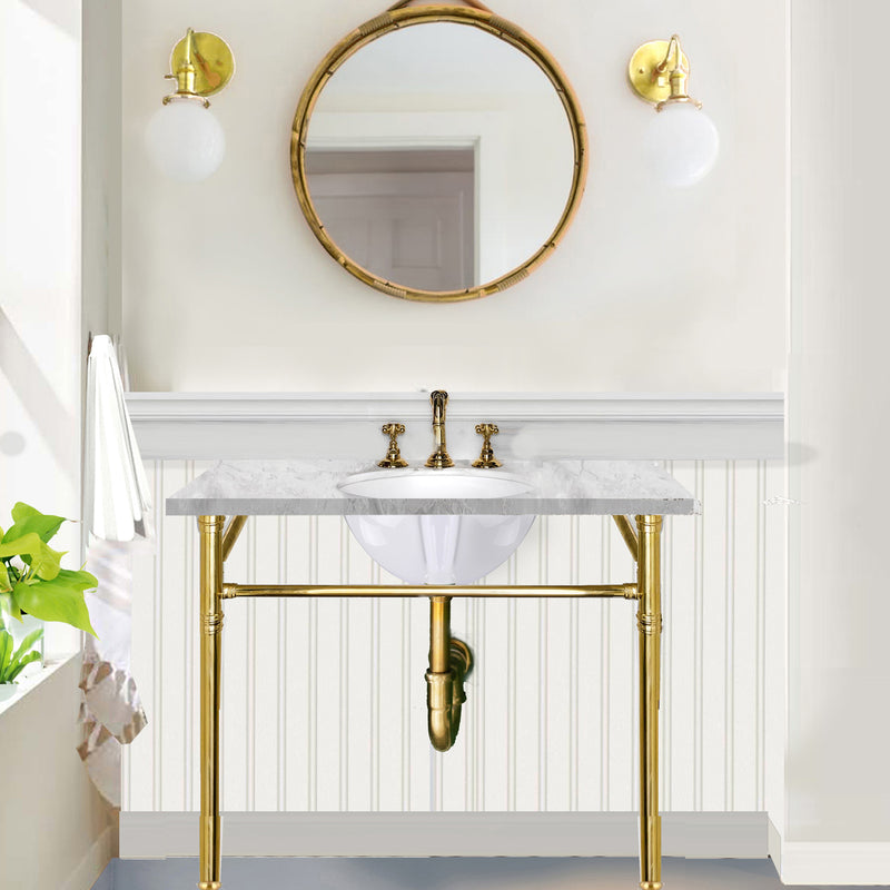 Nantucket Sinks GB-13x10-W oval undermount sink under a marble top on a brass console vanity