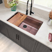 Nantucket Sinks KCH-PS-3220 installed in a white counter with board and black faucet