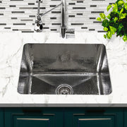 Nantucket Sinks KSSH2318-12 installed in white marble with a chrome faucet over teal cabinets