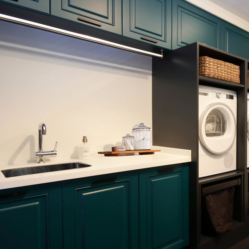 Nantucket Sinks KSSH2318-12 installed in a teal laundry room beside a dryer