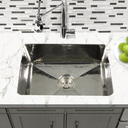 Nantucket Sinks KSSH2318-9 installed in white marble under a chrome bridge faucet