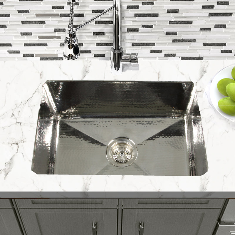 Nantucket Sinks KSSH2318-9 installed in white marble under a chrome bridge faucet
